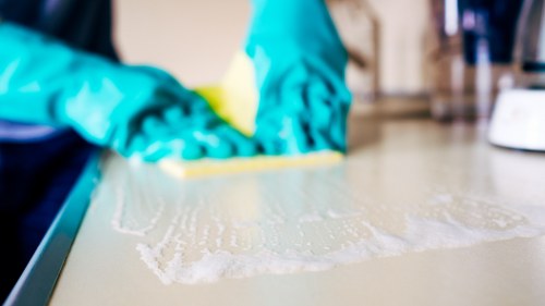 Cleaner using safe methods during a carpet cleaning job