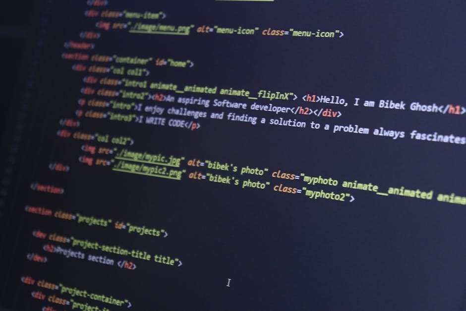 Close-up image of a computer screen displaying lines of computer code with syntax highlighting, including HTML tags, image source links, and comments. The code is written in a text editor with dark ba